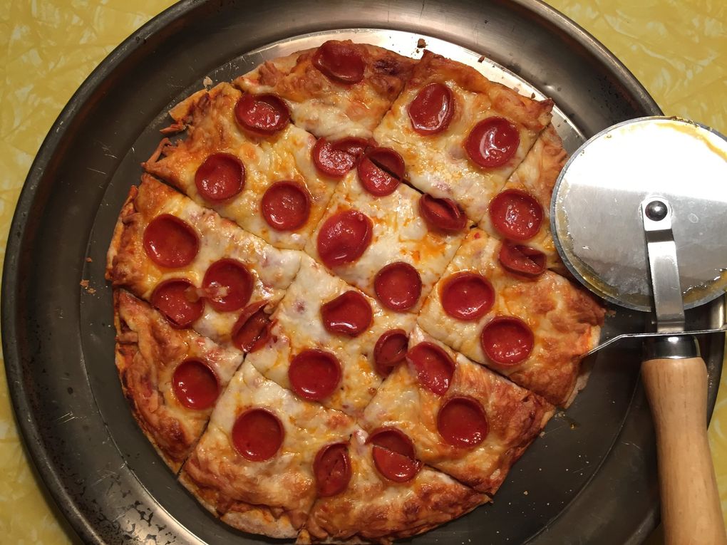 One of La Dive’s pepperoni pizzas — they come frozen, they make great movie-time snacking and they’re most fun served party-cut. (Bethany Jean Clement / The Seattle Times)
