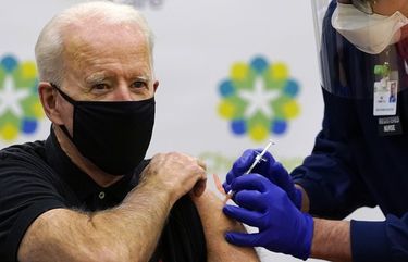 President-elect Joe Biden receives his second dose of the coronavirus vaccine at ChristianaCare Christiana Hospital in Newark, Del., Monday, Jan. 11, 2021. The vaccine is being administered by Chief Nurse Executive Ric Cuming. (AP Photo/Susan Walsh) DESW205 DESW205
