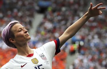 FILE – In this Sunday July 7, 2019 file photo, United States’ Megan Rapinoe celebrates after scoring the opening goal from the penalty spot during the Women’s World Cup final soccer match between US and The Netherlands at the Stade de Lyon in Decines, outside Lyon, France. The Women’s Champions League kicked off this week with interest in European women’s soccer higher than ever after a successful World Cup played in France. As dominant as the United States in the World Cup, Lyon began the Champions League this week with the brightest ever spotlight on women’s soccer in Europe. (AP Photo/Francisco Seco, File) LBJ104