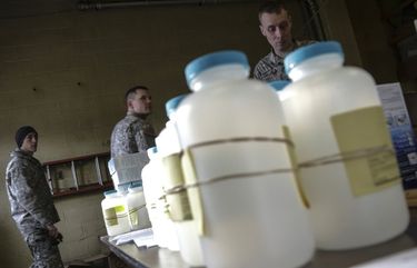 FILE – In this Jan. 18, 2016 file photo, water analysis test kits for Flint, Mich., residents to pick up for lead testing in their drinking water are set out on a table at Flint Fire Department Station No. 1 in Flint. Former Michigan Gov. Rick Snyder, Nick Lyon, former director of the Michigan Department of Health and Human Services, and other ex-officials have been told they’re being charged after a new investigation of the Flint water scandal, which devastated the majority Black city with lead-contaminated water and was blamed for a deadly outbreak of Legionnaires’ disease in 2014-15, The Associated Press has learned. (Ryan Garza/Detroit Free Press via AP, File) MIDTF201 MIDTF201