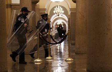 Capitol Police officers gather riot gear inside the Capitol Building as supporters of President Donald Trump mob the building in Washington, Jan. 6, 2021. The police force, which numbers about 2,000 officers and has sole jurisdiction over the Capitol’s buildings and grounds, was clearly outnumbered and unprepared for the onslaught, even as it was openly organized on social media sites like Gab and Parler. (Anna Moneymaker/The New York Times) XNYT54 XNYT54