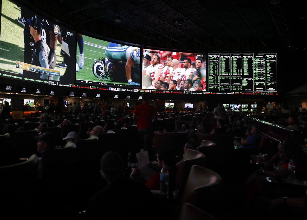 Sports gambling, which is big in Las Vegas at places like The Westgate SuperBook (above), is being debated in Washington. (Isaac Brekken / The New York Times)