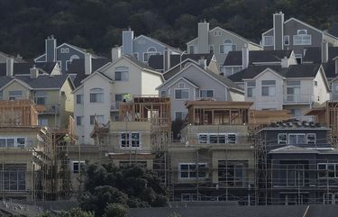 A construction crew works on new homes in San Francisco. (AP Photo/Jeff Chiu, file) 