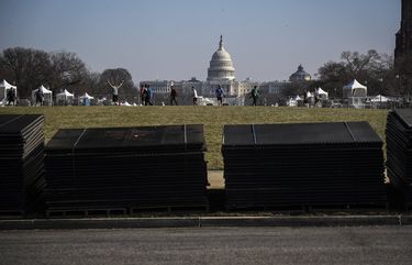 Temporary security fencing is stacked on the National Mall near the Capitol in Washington on Tuesday, Jan. 12, 2021, in advance of Inauguration Day. Security experts have warned that some far-right extremist groups have now started to focus attention on Inauguration Day and are already discussing an assault similar to the one on the Capitol last week. (Oliver Contreras/The New York Times) XNYT130 XNYT130