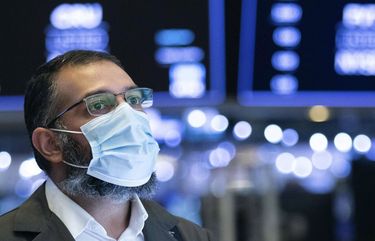 In this photo provided by the New York Stock Exchange, traders work on the floor, Tuesday, Jan. 5, 2021. . (Colin Ziemer/New York Stock Exchange via AP) NYRD202