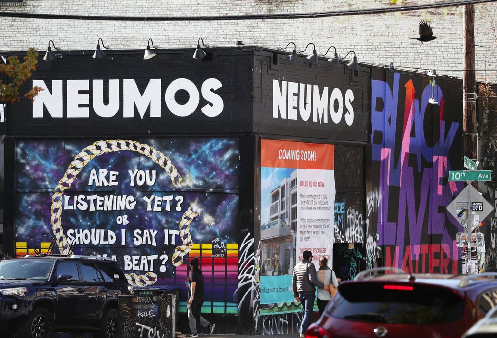 A poster for the Keep Music Live Washington fundraising campaign to aid small independent music venues in the state is seen at the closed Neumos music venue Oct. 14, 2020, on Capitol Hill in Seattle. (Ken Lambert / The Seattle Times)