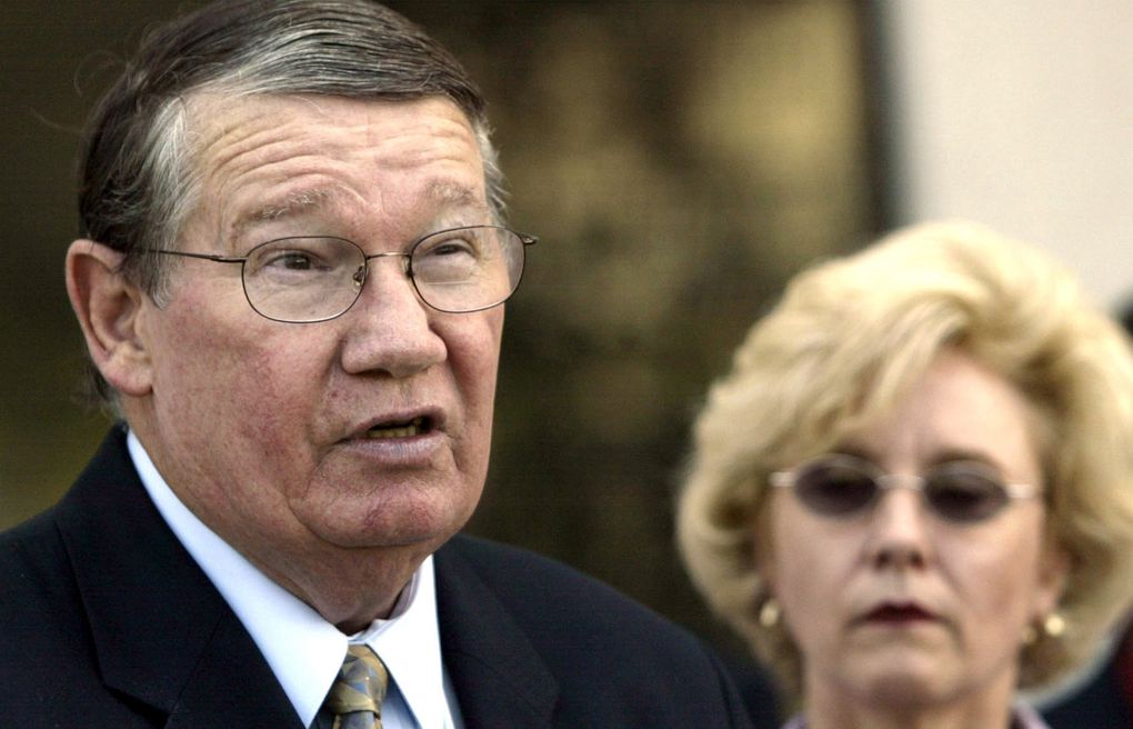 Then-U.S. Rep. Randy “Duke” Cunningham, flanked by his wife Nancy, announces he will not seek re-election on July 14, 2005, in San Marcos, Calif. When he admitted in 2005 to accepting $2.4 million in illegal gifts from defense contractors in exchange for government contracts and other favors, it was considered the largest bribery scandal in congressional history. The disgraced former San Diego congressman received one of the pardons issued Wednesday, Jan. 20, 2021, by President Donald Trump in the final hours of his term. (Lenny Ignelzi / The Associated Press)