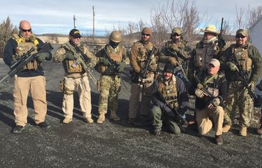 Earlier this month,  supporters of the refuge occupation – drawn from   the Nevada Oath Keepers and Arizona militias  –posed for a picture at an RV park and campground that is located west of the Malheur National Wildlife Refuge.  Some militia members from other parts of the west remain in Harney County, and more are expected in the coming days to due to a recent appeal to protest the actions of federal and state law enforcement.  Photo taken January, 2016.