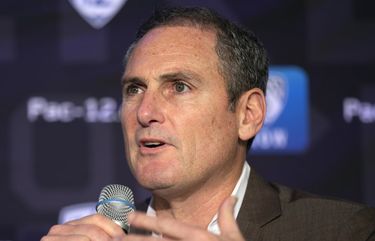FILE – In this Oct. 7, 2019, file photo, Pac-12 Commissioner Larry Scott speaks to reporters during the Pac-12 Conference women’s NCAA college basketball media day in San Francisco. Scott is stepping down at the end of June 2021, ending an 11-year tenure in which the conference landed a transformational billion dollar television deal but struggled to keep up with some of its Power Five peers when it came to revenue and exposure. (AP Photo/D. Ross Cameron, File)