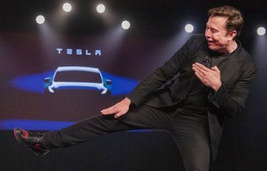 Tesla CEO Elon Musk jokingly motions to kick before introducing the Model Y at Tesla’s design studio Thursday, March 14, 2019, in Hawthorne, Calif. The Model Y may be Tesla’s most important product yet as it attempts to expand into the mainstream and generate enough cash to repay massive debts that threaten to topple the Palo Alto, Calif., company. CAJH105