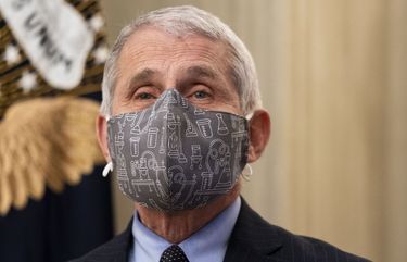 Dr. Anthony Fauci, director of the National Institute of Allergy and Infectious Diseases, talks to reporters before an event with President Joe Biden at the White House in Washington on Thursday, Jan. 21, 2021, where Biden talked about his administration’s COVID-19 response plan. President Biden, pledging a “full-scale wartime effort” to combat the coronavirus pandemic, signed a string of executive orders and presidential directives on Thursday aimed at combating the worst public health crisis in a century, including new requirements for masks on interstate planes, trains and buses and for international travelers to quarantine after arriving in the United States. (Doug Mills/The New York Times) XNYT118 XNYT118
