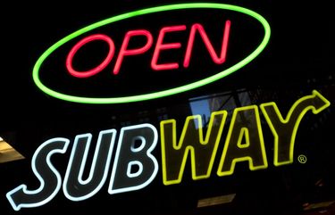 FILE – This Oct. 24, 2016, file photo shows a Subway fast food restaurant’s sign in New York. Subway CEO Suzanne Greco is retiring from the post she took over from her brother following his death three years ago, Subway said in a statement Wednesday, May 2, 2018. Greco will retire on June 30, and Trevor Haynes will take over as interim CEO. Haynes is currently the company’s chief business development officer. (AP Photo/Mark Lennihan, File) NYHK304