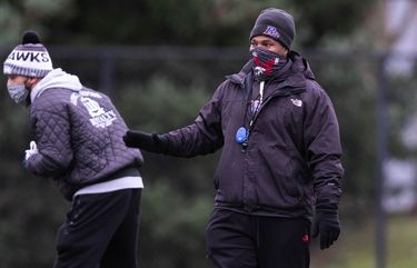 Rainier Beach coach Corey Sampson has to navigate the world of COVID protocols and the requirements of getting a team ready for the football season. (Dean Rutz / The Seattle Times)