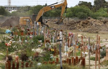 Land is excavated to make way for more burial space in the Maitland cemetery in Cape Town, South Africa, Tuesday, Jan. 19, 2021. The City of Cape Town is working closely with the Muslim Judicial Council to increase burial capacity as COVID-19 claims more lives in a second surge of the pandemic. (AP Photo/Nardus Engelbrecht) XDF102 XDF102