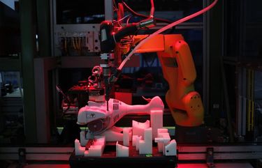 A robot assembles a string trimmer power tool at the Stihl Inc. manufacturing facility in Virginia Beach, Va., on Jan. 11, 2018. MUST CREDIT: Bloomberg photo by Luke Sharrett.