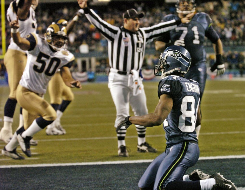 Seattle Seahawks wide receiver Bobby Engram looks on after he failed to catch a pass in the final seconds against the St. Louis Rams of their NFC wildcard playoff game in Seattle, Saturday, Jan. 8, 2005. In background is Rams linebacker Pisa Tinoisamoa (50) and Seahawks tackle Walter Jones (71). The Rams defeated the Seahawks 27-20. (AP Photo/Paul Sakuma) (PAUL SAKUMA / AP)