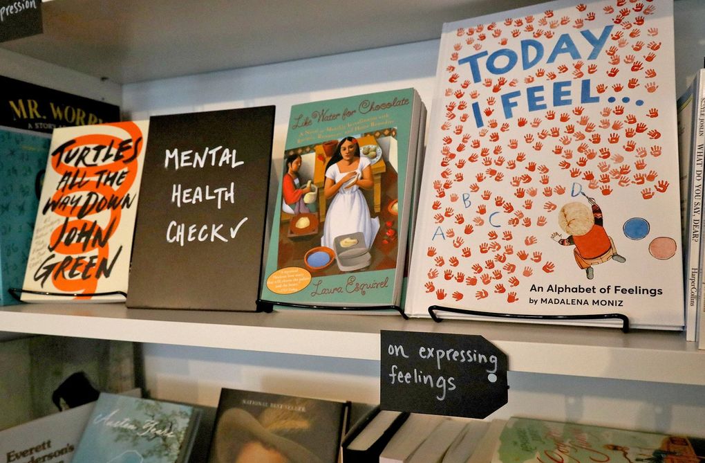 At Oh Hello Again bookstore on Capitol Hill, the focus is bibilotherapy: books that can help us get through challenging times, organized by emotions. (Greg Gilbert / The Seattle Times)
