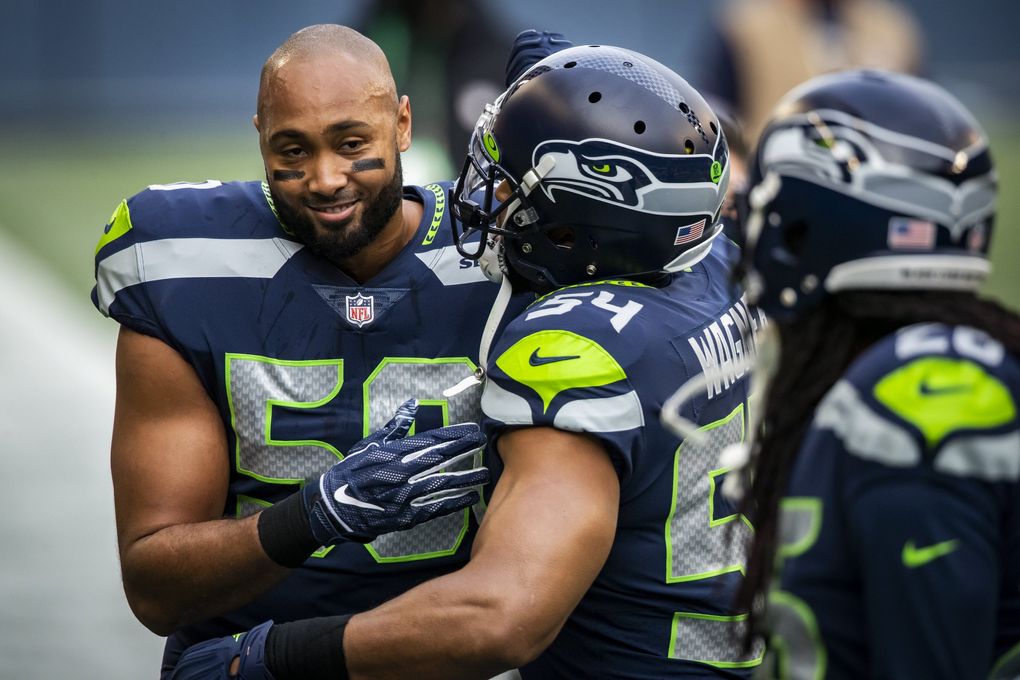 Veteran linebackers K.J. Wright, left, and Bobby Wagner have played key roles in the defense’s turnaround. (Bettina Hansen / The Seattle Times)