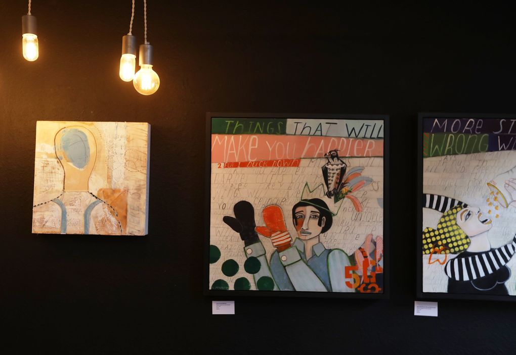 Some of Stacy Milrany’s bigger paintings are seen in her gallery in QA Marketplace on Queen Anne in Seattle. (Ken Lambert / The Seattle Times)