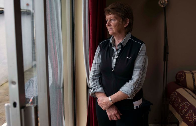 FILE — Catherine Corless, a local historian, at her home in Tuam, County Galway, Ireland, on Aug. 22, 2017. Corless worked to document the deaths of children and infants at the mother and baby home in Tuam. (Paulo Nunes dos Santos/The New York Times)