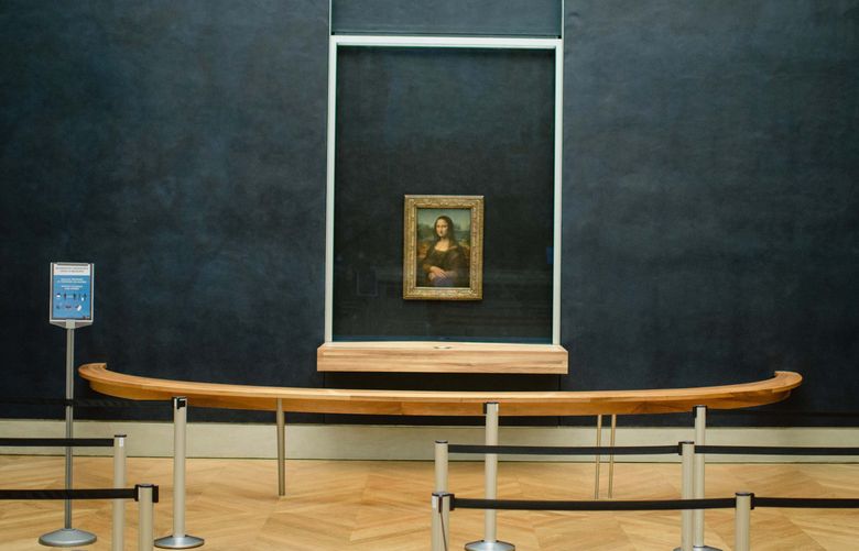 Leonardo da Vinci’s “Mona Lisa” in an empty gallery at the Louvre in Paris on Dec. 4, 2020. With the Louvre closed because of the coronavirus pandemic, museum officials are pushing ahead on a grand restoration and cleanup. (Dmitry Kostyukov/The New York Times)