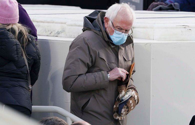 FILE — Sen. Bernie Sanders (I-Vt.) and his unique mittens, which attracted attention on social media, at President Joe BidenÕs Inauguration Day on Capitol Hill in Washington, Jan. 20, 2021. Crafters in search of knitwear from pop culture are designing their own patterns. (Ruth Fremson/The New York Times)