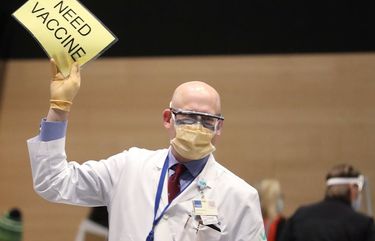 Dr. John Corman MD, signals for more Pfizer vaccine as Amazon partners with Virginia Mason creating a pop-up COVID-19 vaccine clinic in Amazon’s 7th Avenue meeting center in Seattle, Sunday, Jan. 24, 2021. 216188