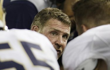 Montana State head coach Jeff Choate, center, speaks to his team during the second half of an NCAA college football game against Washington State in Pullman, Wash., Saturday, Sept. 2, 2017. Washington State won 31-0. (AP Photo/Young Kwak)