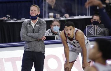Gonzaga head coach Mark Few, left, speaks with guard Jalen Suggs during the second half of an NCAA college basketball game against Pacific in Spokane, Wash., Saturday, Jan. 23, 2021. (AP Photo/Young Kwak) OTK OTK