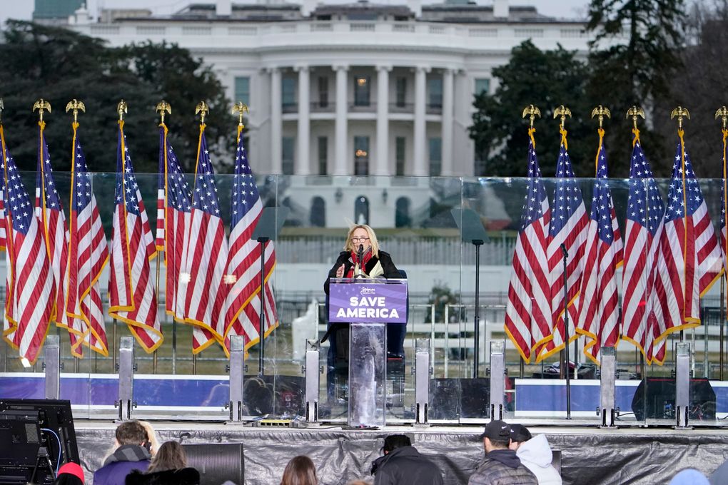 With the White House in the background, Pastor Paula White leads a prayer Wednesday, Jan. 6, 2021, in Washington, at a rally in support of President Donald Trump called the “Save America Rally.” (Jacquelyn Martin / The Associated Press)