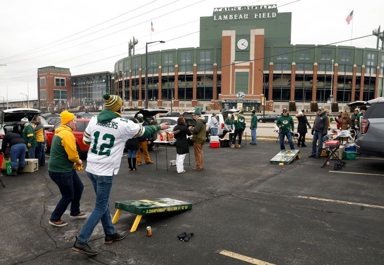 A Green Bay Packers fan on the field before an NFL game against