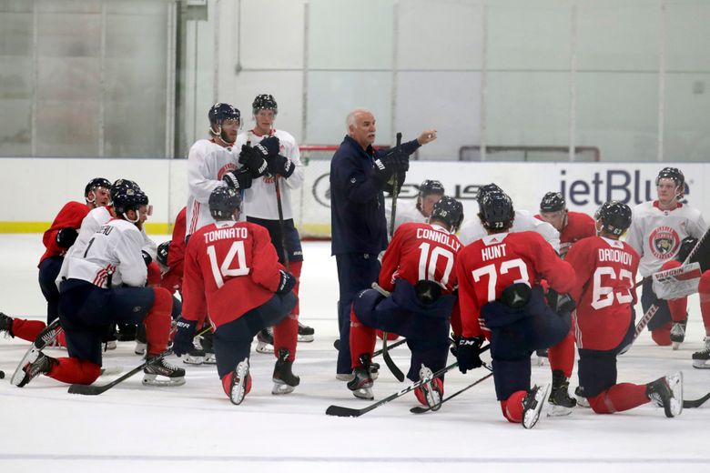 Florida Panthers head coach Joel Quenneville skates during the