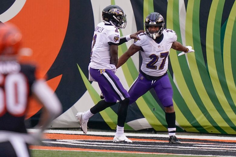 Baltimore Ravens running back J.K. Dobbins (27) runs with the ball