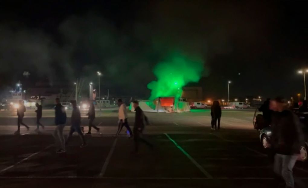 In this image made from video, a COVID-19 testing center is seen after being set on fire in Urk, 80 kilometers (50 miles) northeast of Amsterdam, Saturday, Jan. 23, 2021. Dutch police have clashed with protesters demonstrating against the country’s lockdown in the capital, Amsterdam and the southern city of Eindhoven. The unrest comes a day after rioting youths protesting on the first night of the country’s curfew torched a coronavirus testing facility in Dutch fishing village Urk. (Pro News via AP)