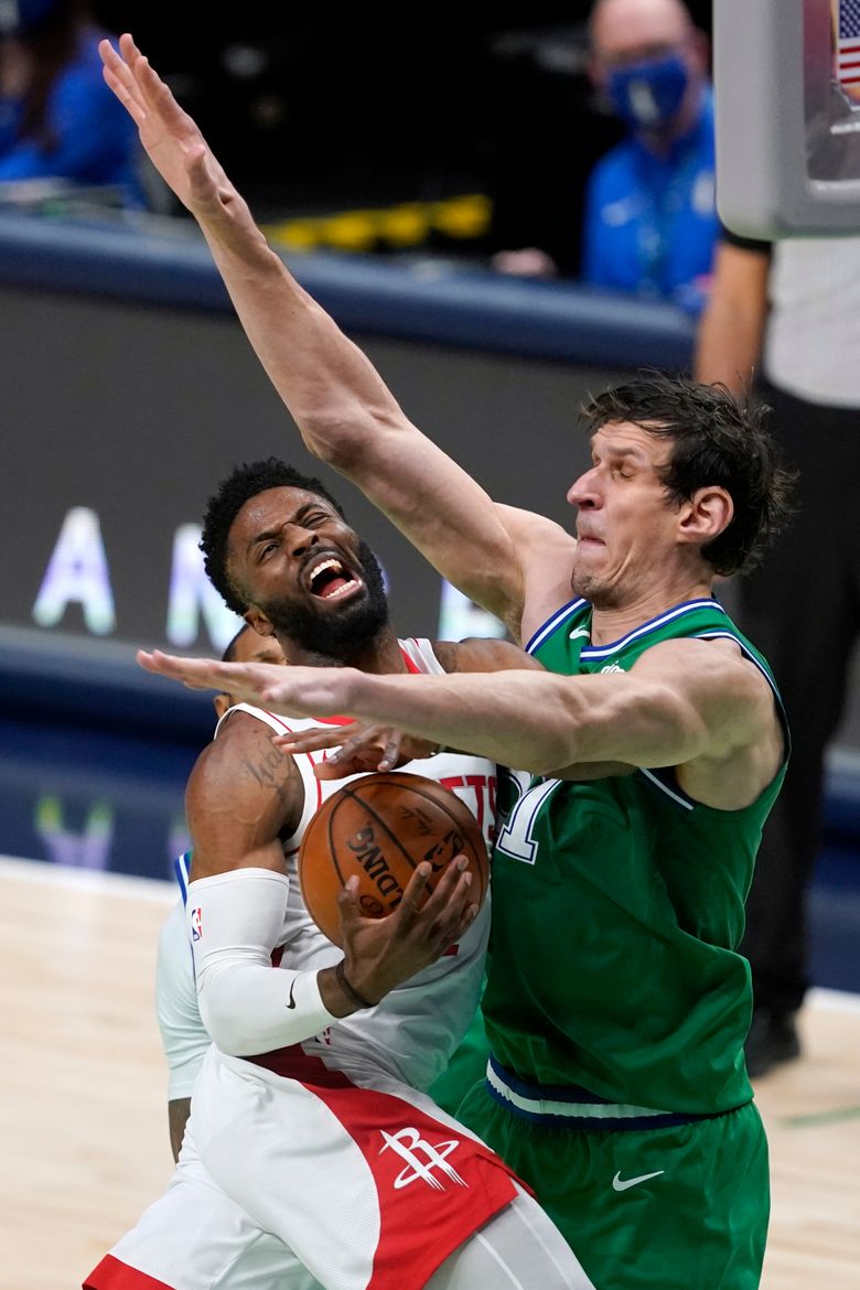 Dallas Mavericks' Boban Marjanovic shakes hands with a fan prior