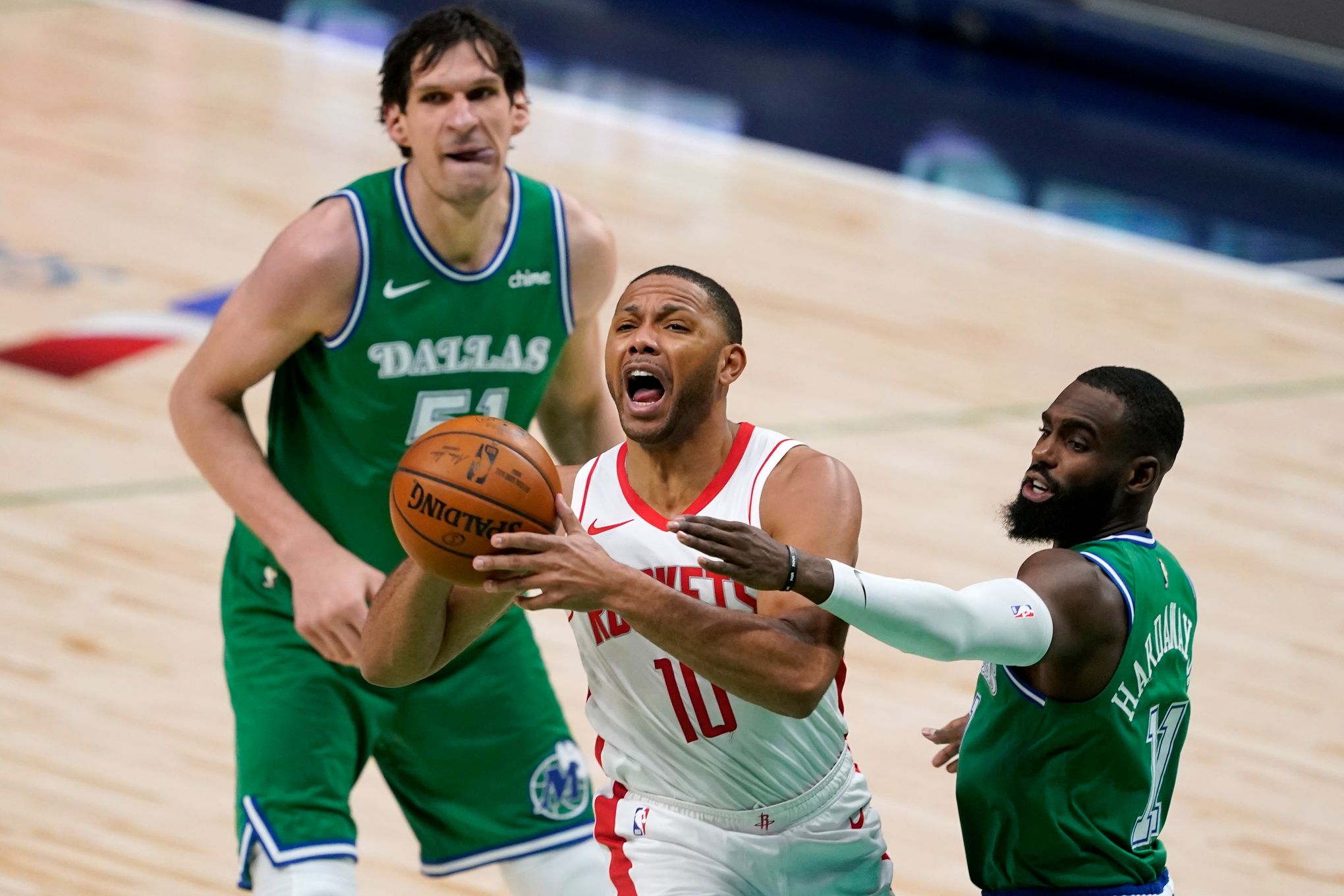 Boban Marjanovic and Luka Doncic of the Dallas Mavericks shake