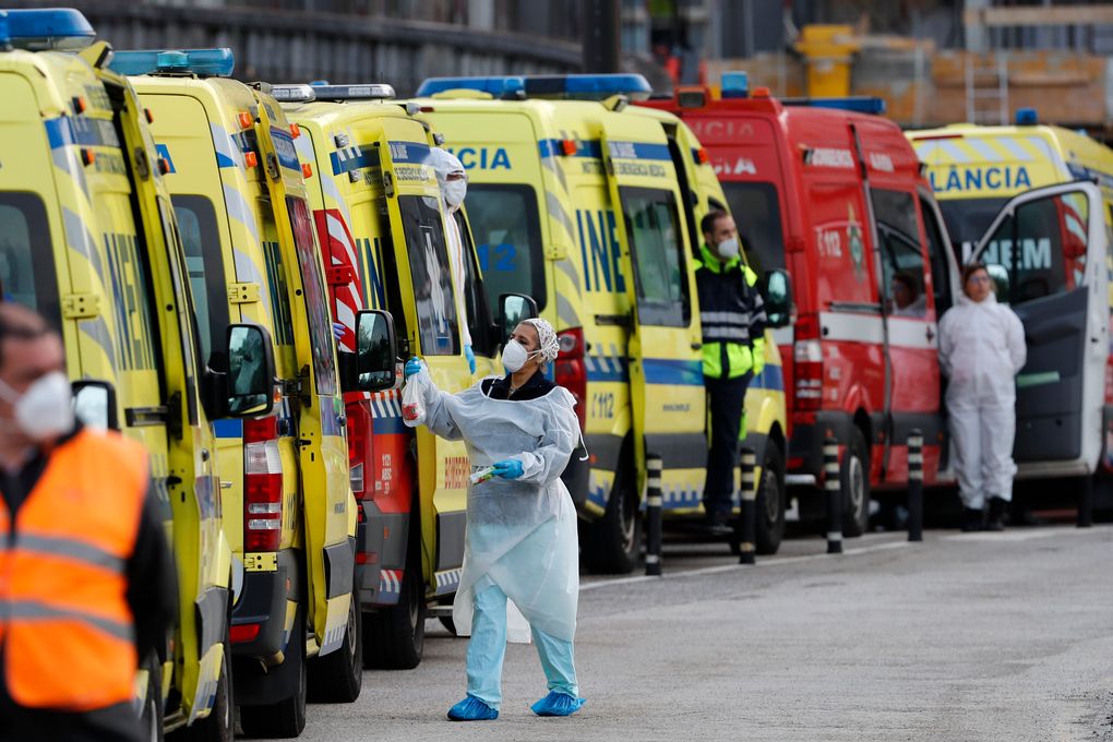 FILE – In this Jan. 22, 2021, file photo, more than a dozen ambulances queue waiting to hand over their COVID-19 patients to medics at the Santa Maria hospital in Lisbon. In its fight against COVID-19, Portugal lifted restrictions on gatherings and movements for four days over Christmas so that people could spend the festive season with family and friends. Soon after the holiday, the pandemic quickly got out of hand. (AP Photo/Armando Franca, File)