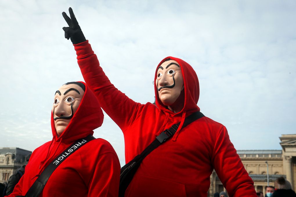 People wearing masks take part in a hospitality sector workers protest, in Budapest, Hungary, Sunday, Jan. 31, 2021. Protesters gathered at a central square in Hungary’s capital of Budapest on Sunday demanding a rethinking of the country’s lockdown restrictions. As the lockdown limiting restaurants to take-away service approaches the three-month mark, many business owners complain that they have received little to none of the government’s promised financial assistance while other businesses like shopping malls and retail stores have been permitted to remain open. (AP Photo/Laszlo Balogh)