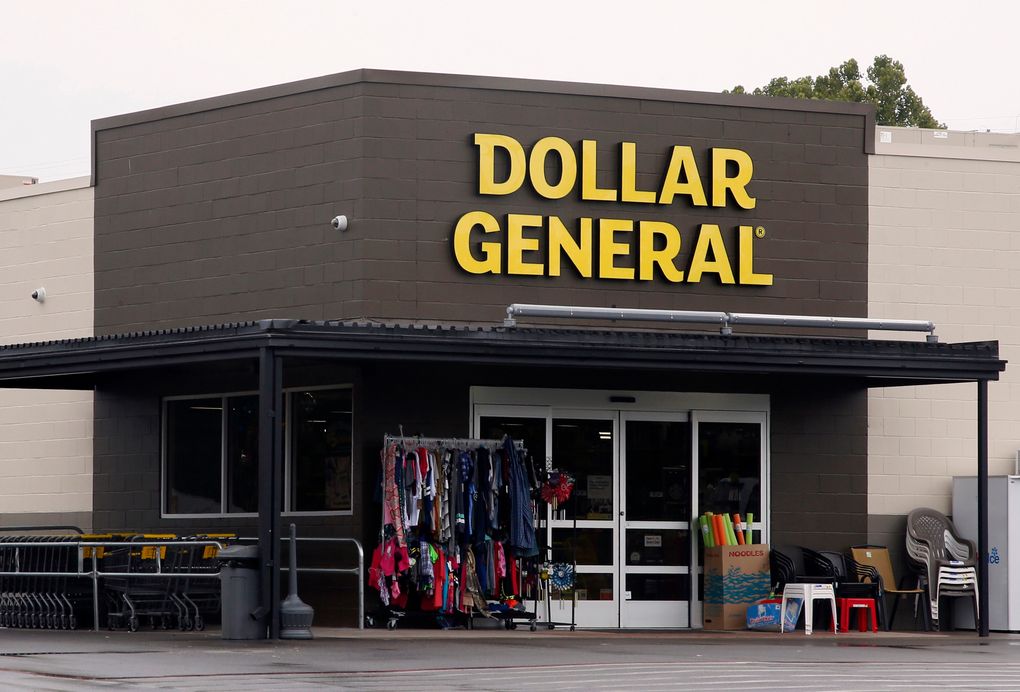 FILE- In this Aug. 3, 2017, file photo the Dollar General store is pictured in Luther, Okla. As vaccinations continue across the U.S., some companies are offering financial incentives to encourage their workers to get the shots. Dollar General is one of the first major companies to announce extra pay for workers who get vaccinated. The Tennessee-based retailer said Wednesday, Jan. 13, 2021 it will give employees the equivalent of four hours of pay if they get the vaccine. (AP Photo/Sue Ogrocki, File)