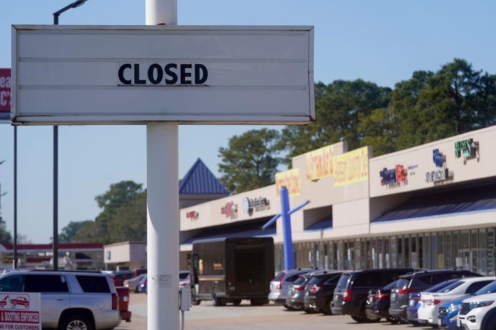 The closed sign of a former restaurant is displayed at a shopping center Wednesday, Jan. 13, 2021, in Houston. The latest figures for jobless claims, issued Thursday, Jan. 14, by the Labor Department, remain at levels never seen until the virus struck. (Melissa Phillip/Houston Chronicle via AP)