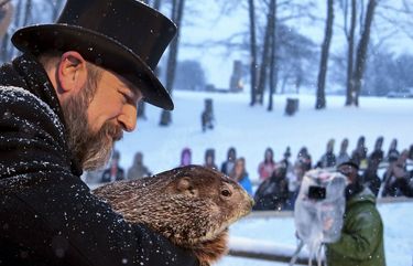 Groundhog Club handler A.J. Dereume holds Punxsutawney Phil, the weather prognosticating groundhog, during the 135th celebration of Groundhog Day on Gobbler’s Knob in Punxsutawney, Pa., Tuesday, Feb. 2, 2021. Phil’s handlers said that the groundhog has forecast six more weeks of winter weather during this year’s event that was held without anyone in attendance due to potential COVID-19 risks. (AP Photo/Barry Reeger) PABR120 PABR120