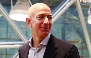 Jeff Bezos, center, tours The Spheres at Amazon’?s campus in downtown Seattle Monday, Jan. 29, 2018. The Spheres house more than 40,000 plants, and features waterfalls, fish tanks and 40-foot trees. 
 204988 204988

decade 13 influential