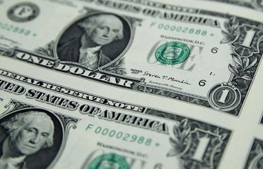 Treasury Secretary Steven Mnuchin’s signatures is seen on new dollar bills, Wednesday, Nov. 15, 2017, at the Bureau of Engraving and Printing in Washington. The new Mnuchin-Carranza notes, which are a new series of 2017, 50-subject $1 notes, will be sent to the Federal Reserve to issue into circulation. (AP Photo/Jacquelyn Martin)