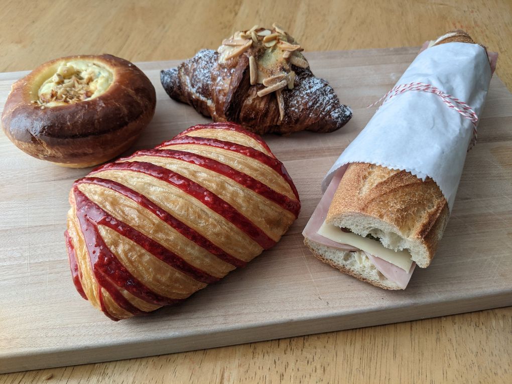Don’t miss the fig and goat cheese brioche from La Fête Pâtisserie Française, plus the raspberry-and-chocolate croissant, twice-baked almond croissant and ham-and-butter baguette sandwich. (Jackie Varriano / The Seattle Times)