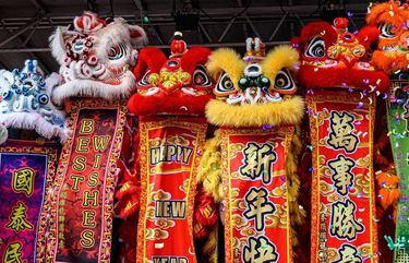 Lion dancers from the Mak Fai Washington Kung Fu Club perform in the Chinatown International District at last year’s Lunar New Year celebrations.