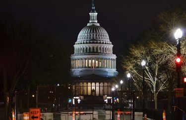 The Capitol is seen behind reinforced barricades as the second impeachment trial of former President Donald Trump begins in the Senate in Washington, Tuesday, Feb. 9, 2021. Trump was charged by the House with incitement of insurrection for his role in agitating a violent mob of his supporters that laid siege to the U.S. Capitol on Jan. 6, and sent members of Congress into hiding as they met to validate President Joe Biden’s victory. (AP Photo/J. Scott Applewhite) DCSA101 DCSA101
