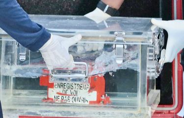 Members of National Transportation Safety Committee place a box containing the flight data recorder of Sriwijaya Air flight SJ-182 retrieved from the Java Sea where the passenger jet crashed into a container after a press conference at Tanjung Priok Port, Tuesday, Jan. 12, 2021. Indonesian navy divers searching the ocean floor on Tuesday recovered the flight data recorder from a Sriwijaya Air jet that crashed into the Java Sea with 62 people on board, Saturday, Jan. 9, 2021. (AP Photo/Dita Alangkara) XJAK127