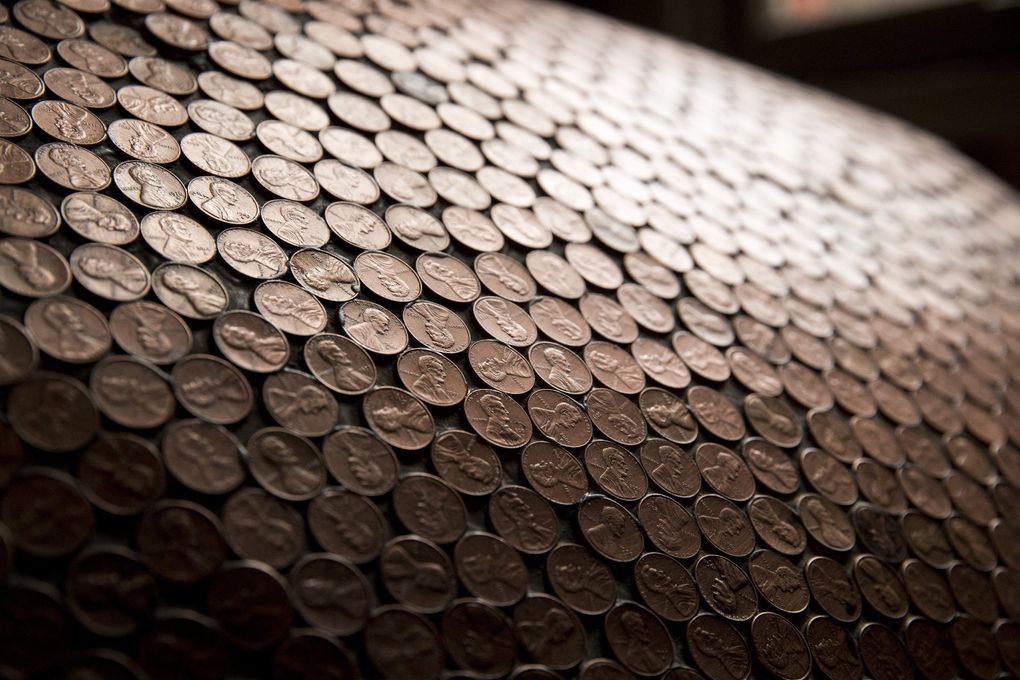 Pennies line the wood-fired oven built by Ian Galbraith for his Pierce County pizzeria, The Carlson Block. (Amanda Snyder / The Seattle Times)