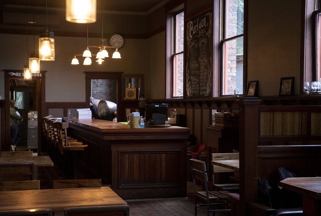 Ian and Ashley Galbraith opened The Carlson Block inside a 110-year-old building in Wilkeson, Pierce County. Their pizzeria was once the site of The Carlson Block, a hotel servicing the town, then a thriving hub of industry. (Amanda Snyder / The Seattle Times)