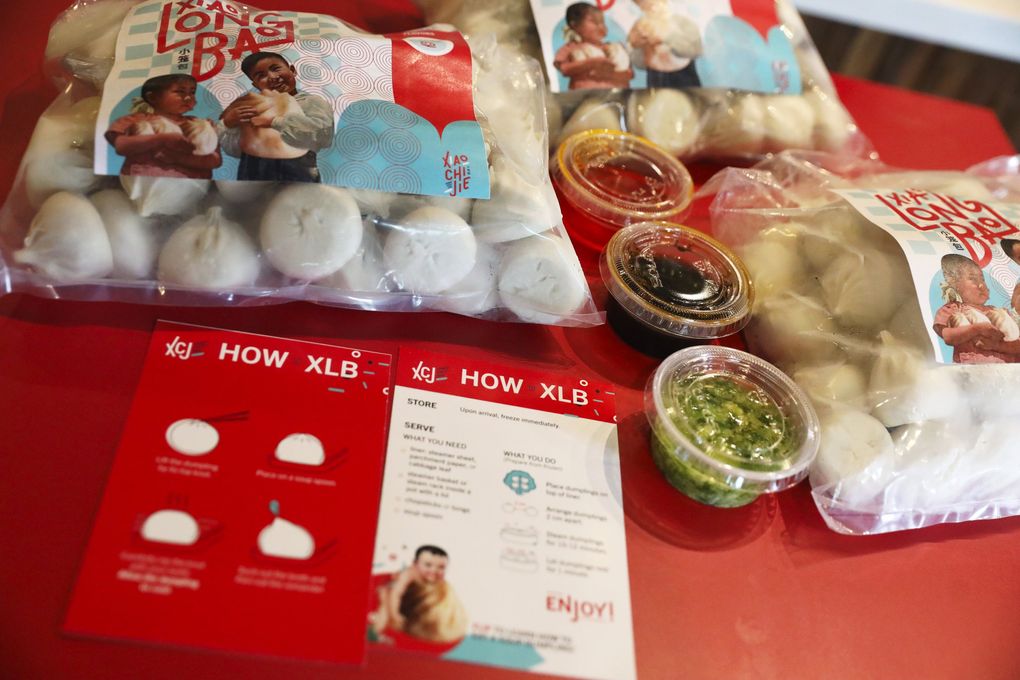 Xiao Chi Jie frozen xiao long bao orders include dipping sauces, from top: chili oil, vinegar and umami, plus instructions (with more detailed ones available on the XCJ blog, to really get your steaming technique where it ought to be). (Ken Lambert / The Seattle Times)